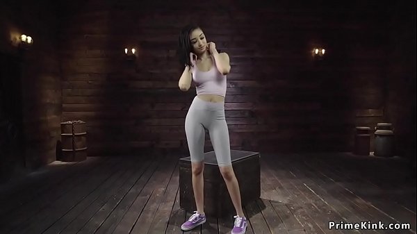 Slim babe strips and fucks machine